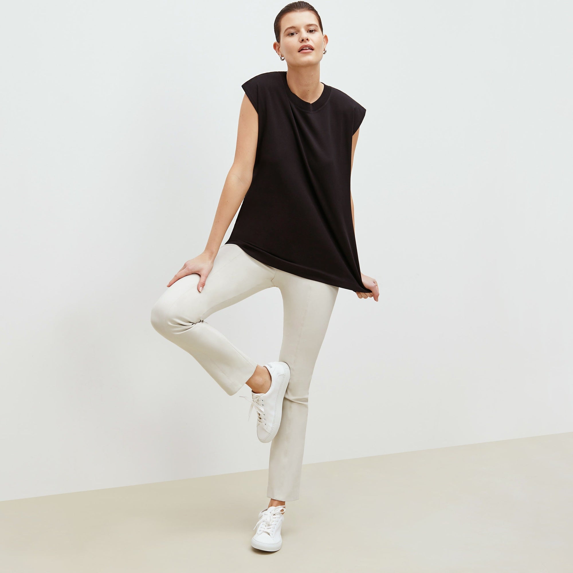 Front image of a woman standing wearing the foster pant in bone | Exclude