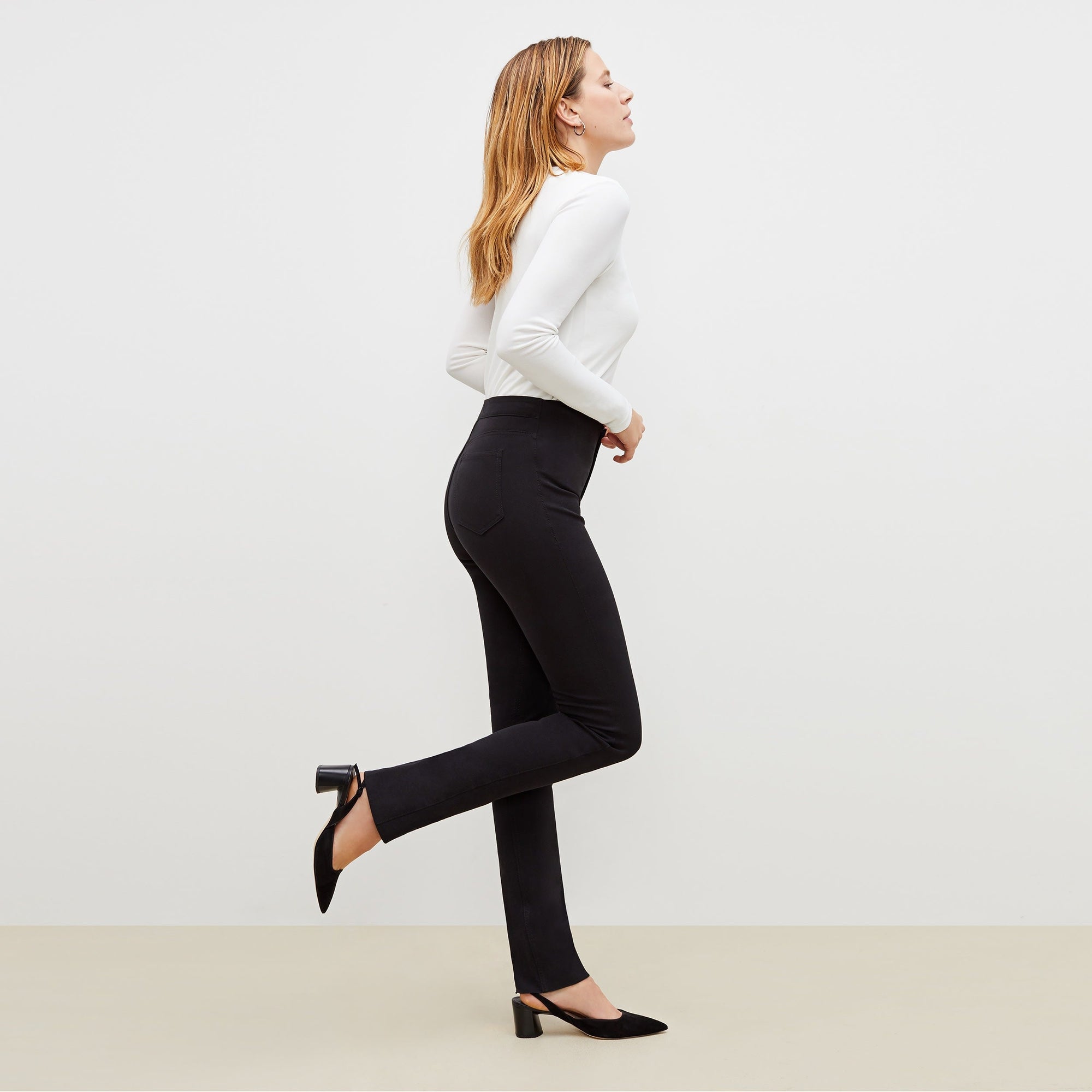 side image of a woman standing wearing the Hockley pant easy cotton in Black | Exclude