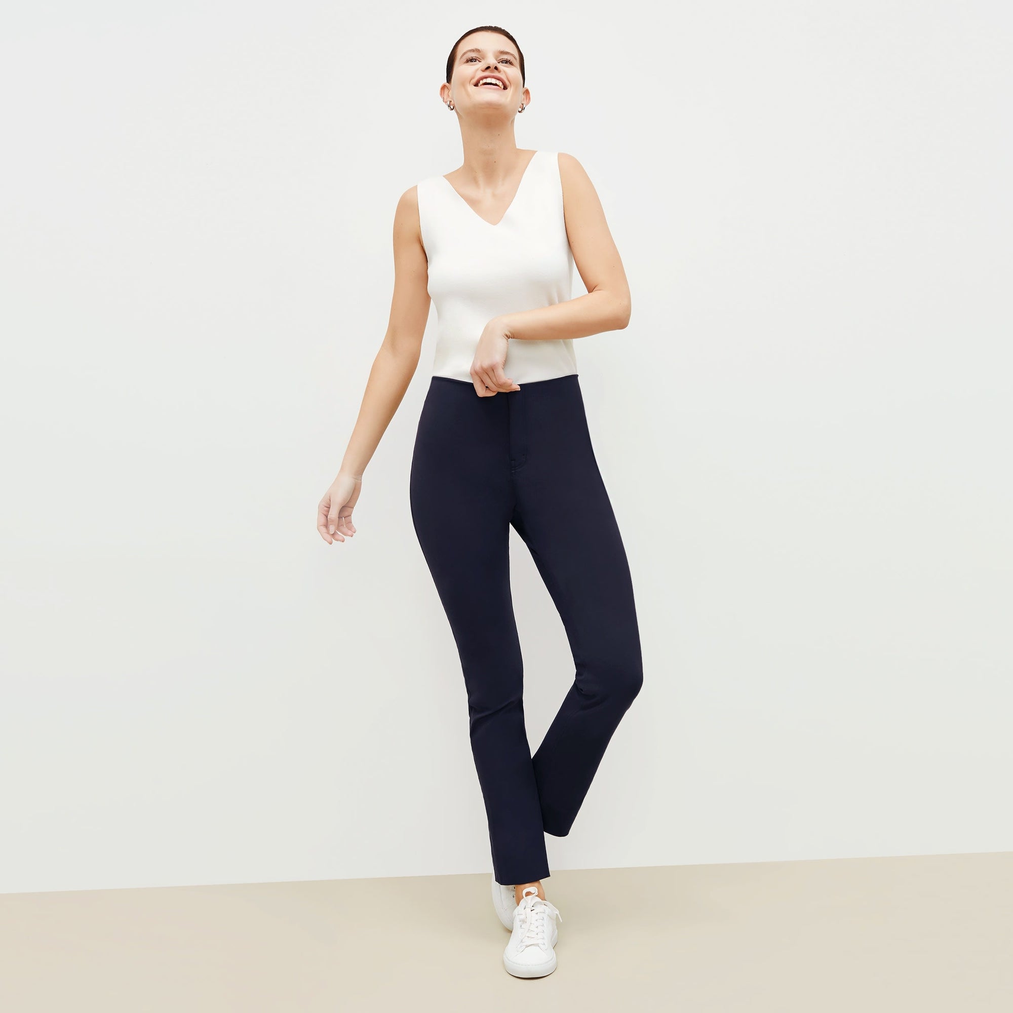 Front image of a woman standing wearing the Hockley pant in ink | Exclude