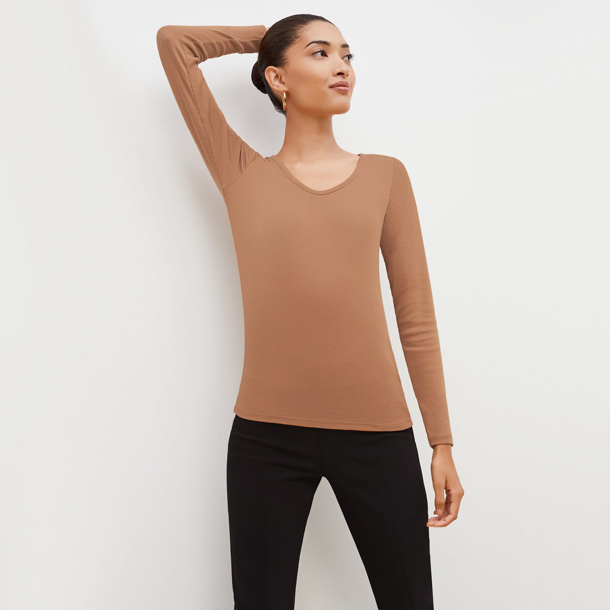 Front image of a woman standing wearing the marcia in camel | Exclude