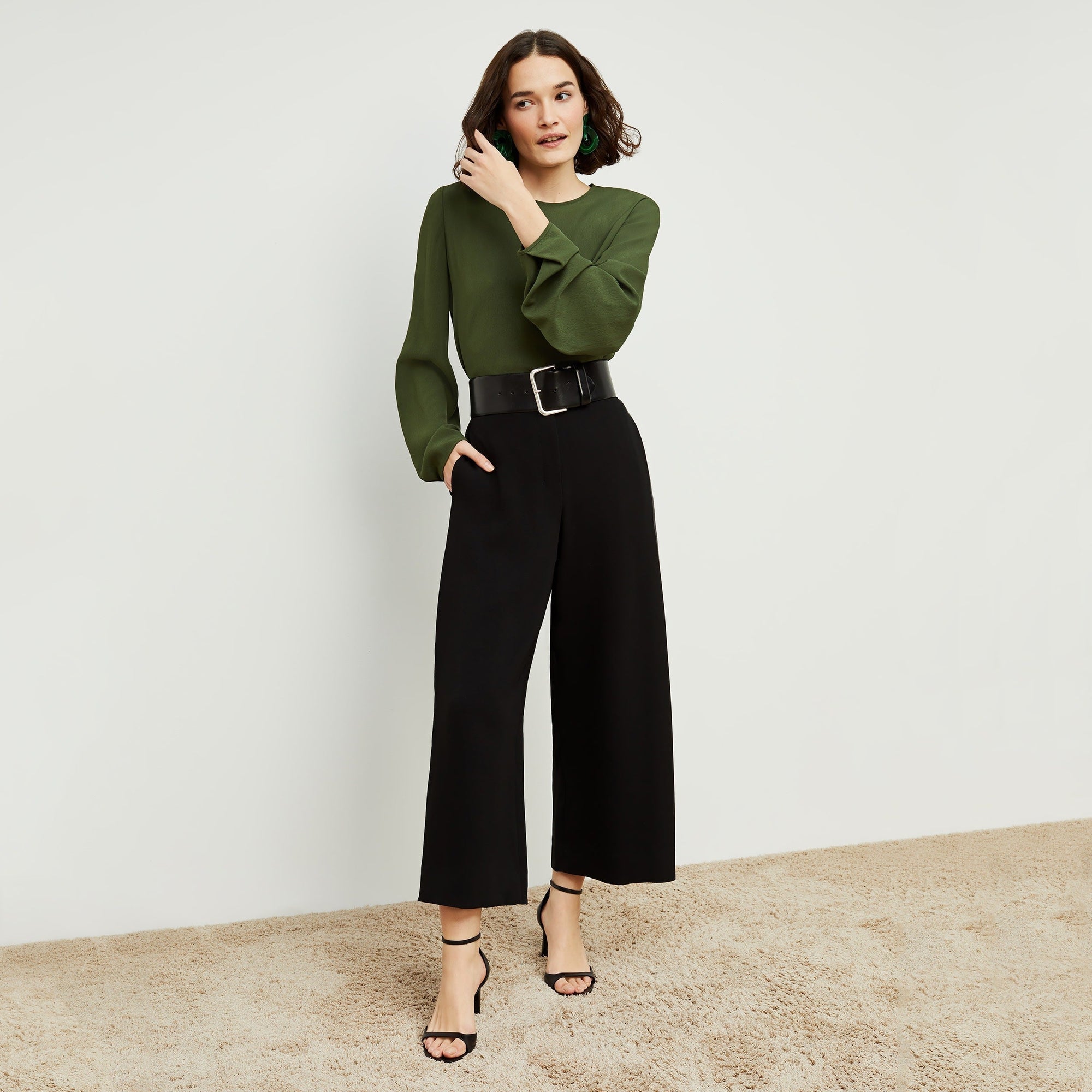Front image of a woman standing wearing the Zhou culotte in black | Exclude