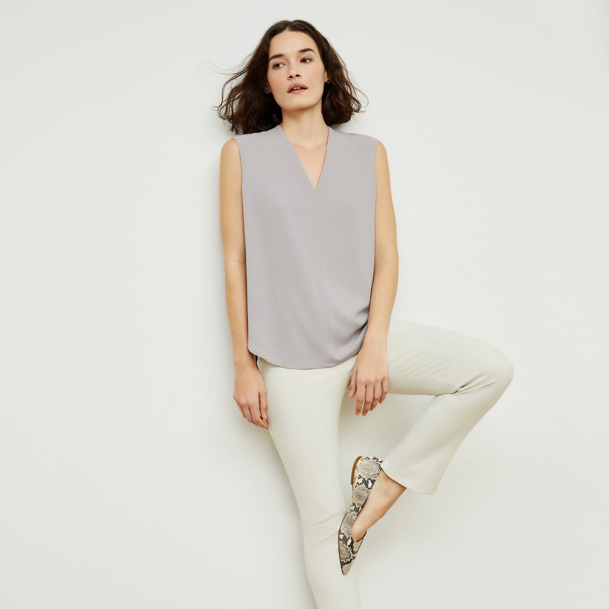 Front image of a woman standing wearing the foster pant in bone | Exclude