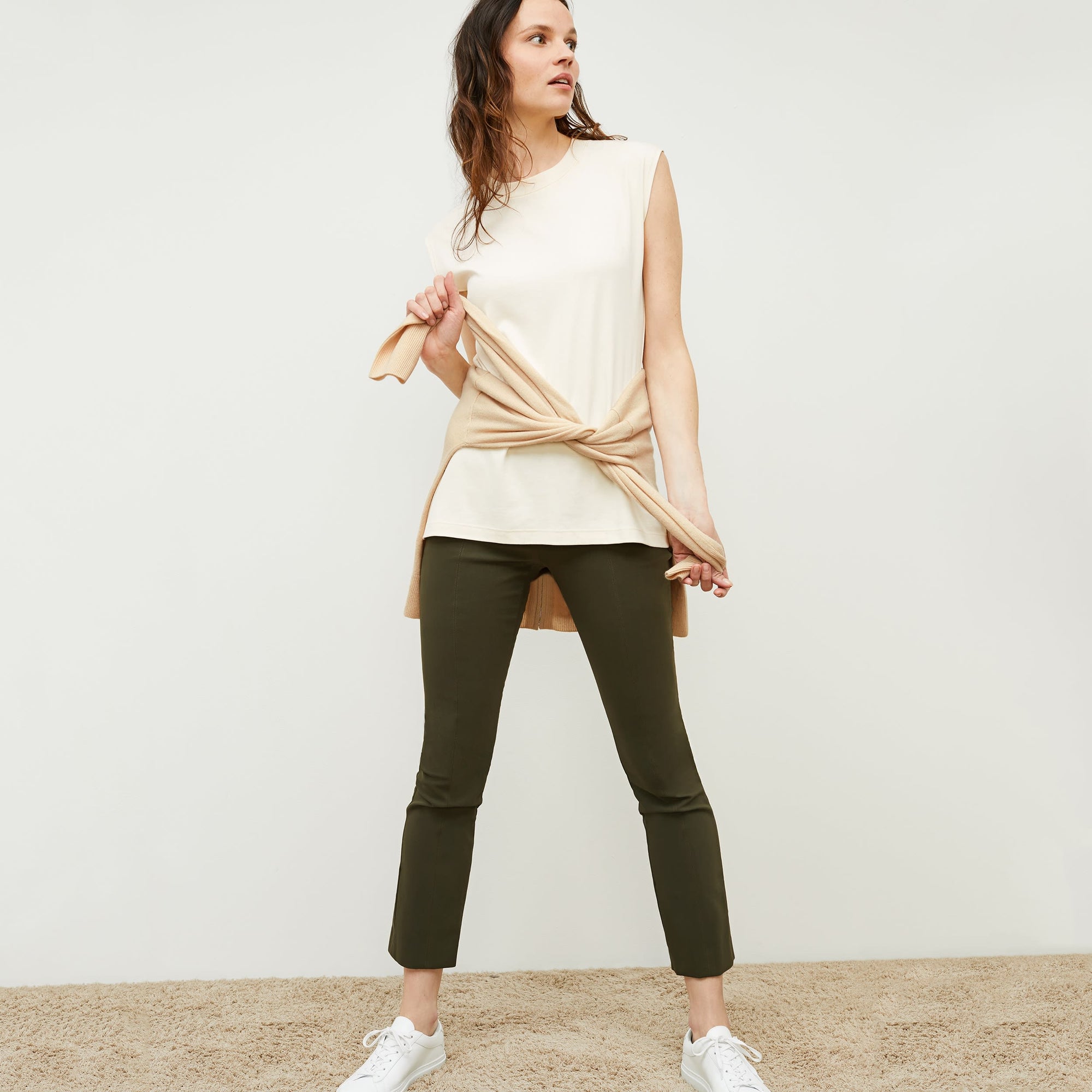 front image of woman wearing foster pant in dark olive | Exclude