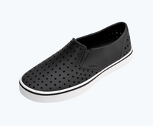 Angled view of a Native Shoes Miles | Jiffy Black/ Shell White Footwear