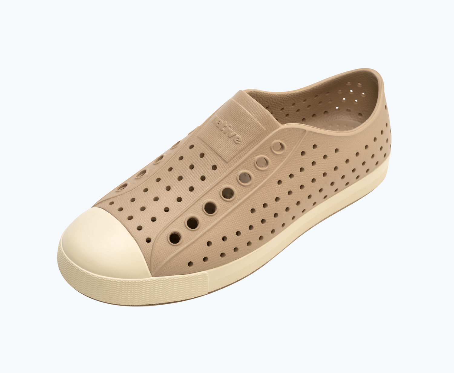Angled view of a Native Shoes Jefferson | Flax Tan/ Bone White Footwear