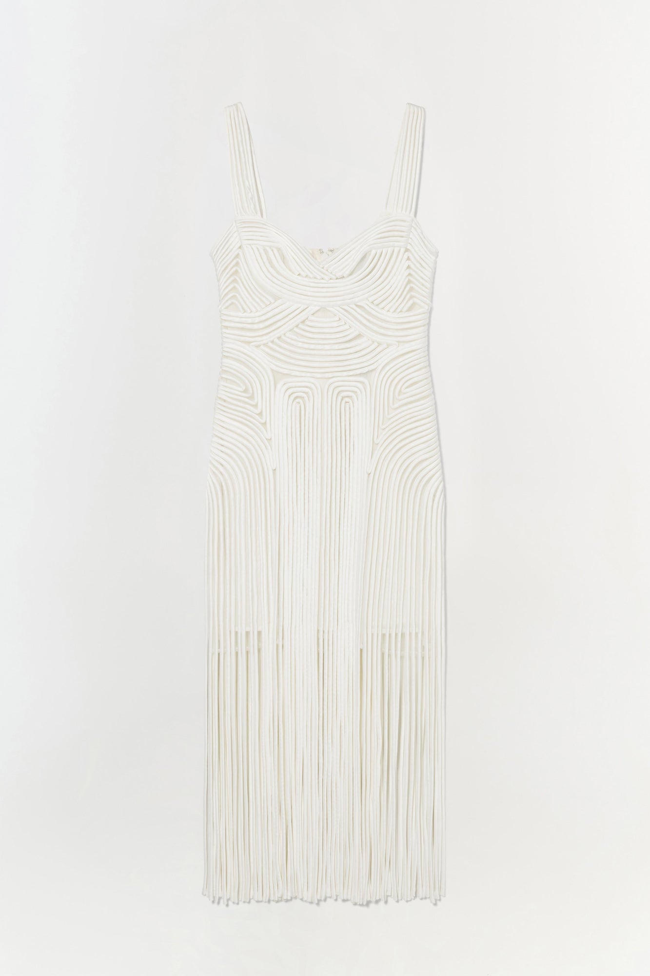 Cream sleeveless dress with curved neckline and geometric ribbed pattern throughout, featuring pleated skirt.
