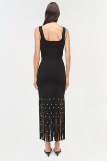 Black knit midi dress with square neckline and beaded fringe hem at bottom.