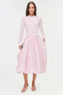 Pink midi dress with long-sleeve ribbed knit top and gathered taffeta skirt.