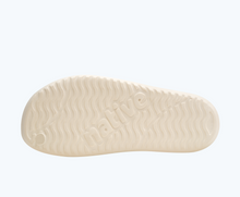 Bottom view of a Native Shoes Spencer Lx Print | Shell White/ Shell White/ Rainbow Tie Dye Footwear