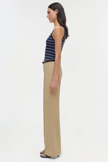 Beige wide-leg trouser with high waist, shown from side on model wearing navy striped tank top.