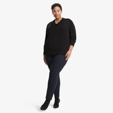 Front image of a woman standing wearing the Alma top in Black