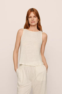 Model is wearing Organic Linen Knit Boat Neck Crop Tank in Ivory