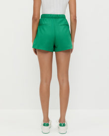 Cole Short in green cotton, Rylee Pointelle Tank Top in white cotton, and Topspin Cream/Green Court Sneaker.