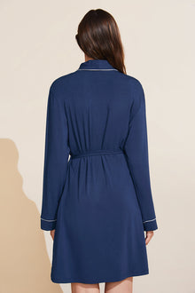 Model is wearing the Gisele TENCEL Modal Robe in navy/ivory.