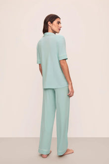 Model is wearing Gisele Tencel Modal Short Sleeve & Pant Pj Set in Canal Blue/Ivory