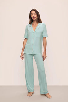 Model is wearing Gisele Tencel Modal Short Sleeve & Pant Pj Set in Canal Blue/Ivory