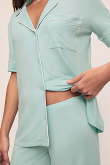 Model is wearing Gisele Tencel Modal Short Sleeve & Pant Pj Set in Canal Blue/Ivory