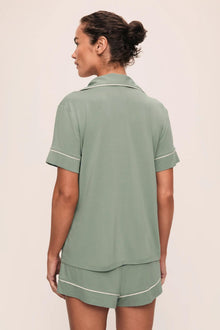 Model is wearing Gisele TENCEL Modal Relaxed Short PJ Set in Eucalyptus/Ivory