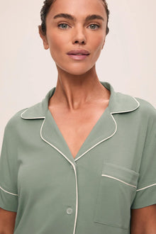 Model is wearing Gisele TENCEL Modal Relaxed Short PJ Set in Eucalyptus/Ivory