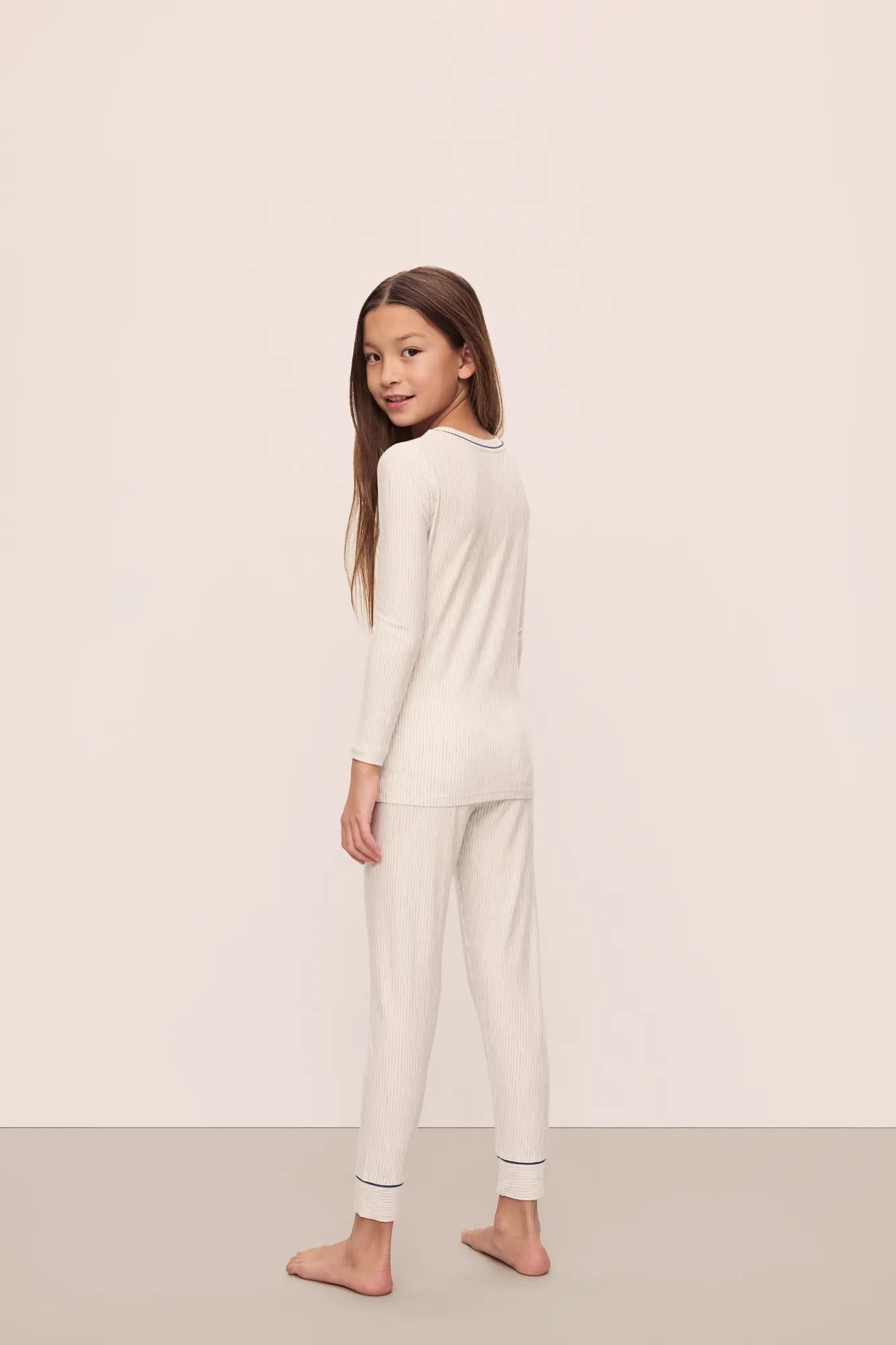 Model is wearing Kids Printed TENCEL Modal Unisex Long PJ Set in Heritage Stripe Light Heather Grey/Peppercorn