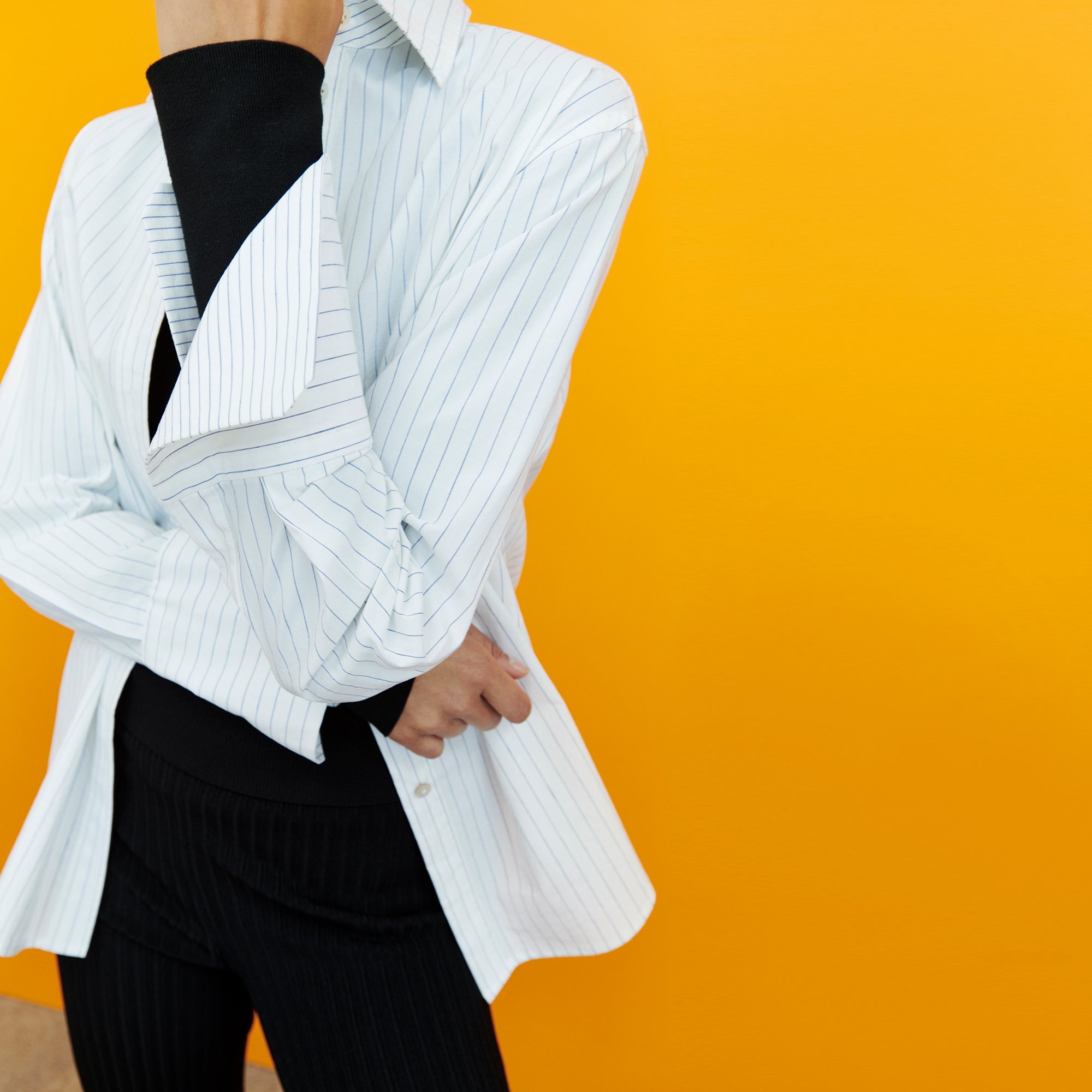 Front image of a woman wearing the Mila Button Down - Poplin Stripe in Blue / Ivory | Exclude