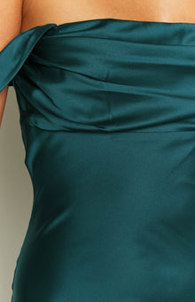Close-up of the teal satin off-shoulder neckline with draped detail and fitted bodice