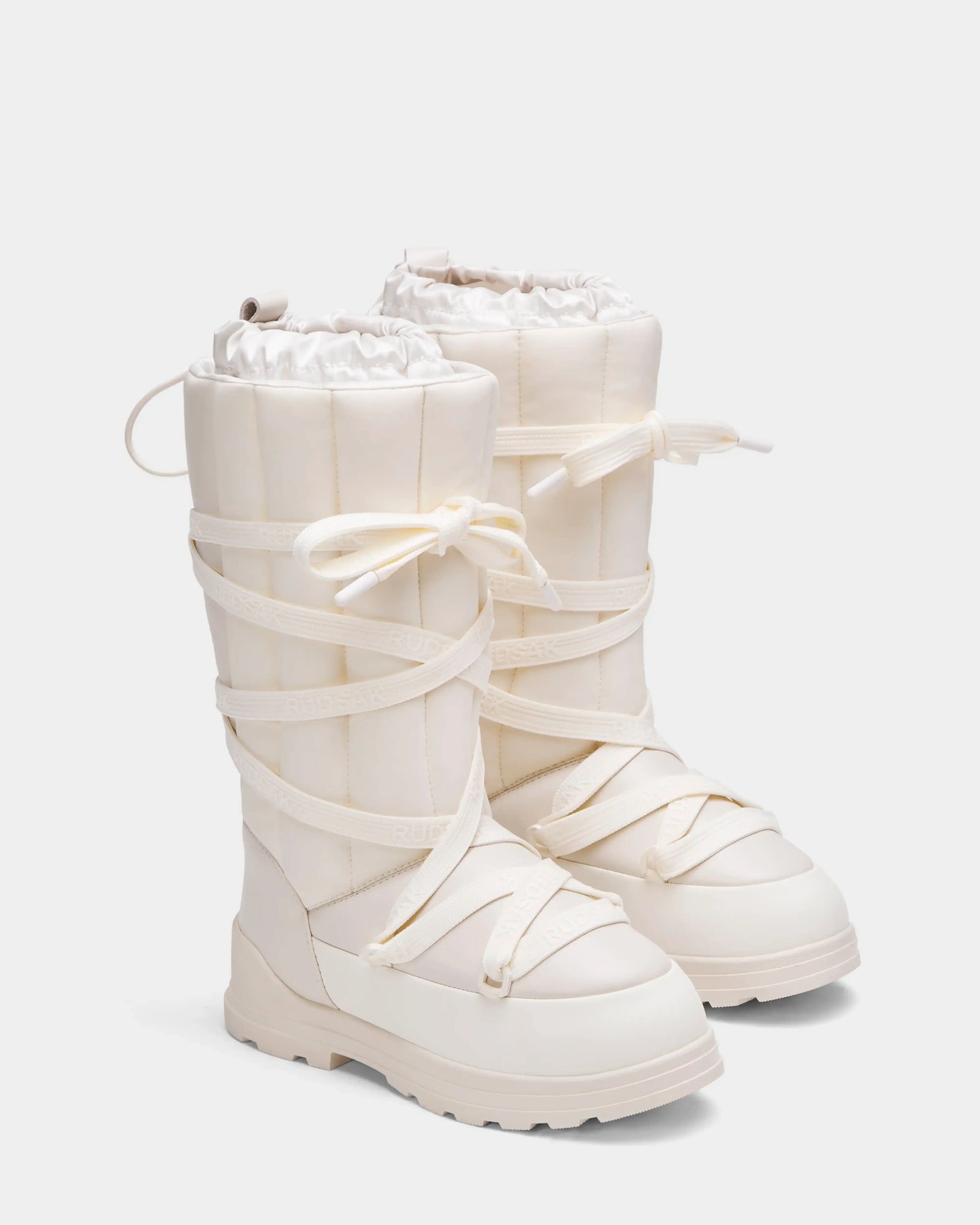 RODIN - 8224502 Iceland by Rudsak: tall off-white womens winter boots featuring thick anti-slip soles, wide crisscross laces, and a top drawstring—crafted for cozy warmth and stylish comfort all season long.