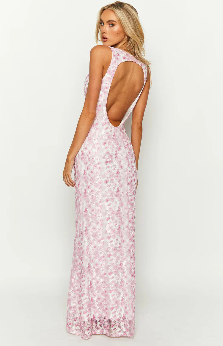 Rear view of a pink lace maxi dress with a deep scoop back and heart-shaped cutout