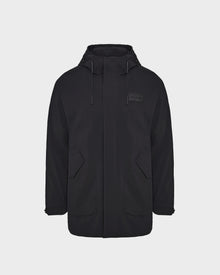 The Rudsak IAN - 6124009 Black mens long raincoat features a high collar, hood with adjustable drawstrings, front zipper, two large flap pockets, and water-repellent fabric, shown on a plain white background.