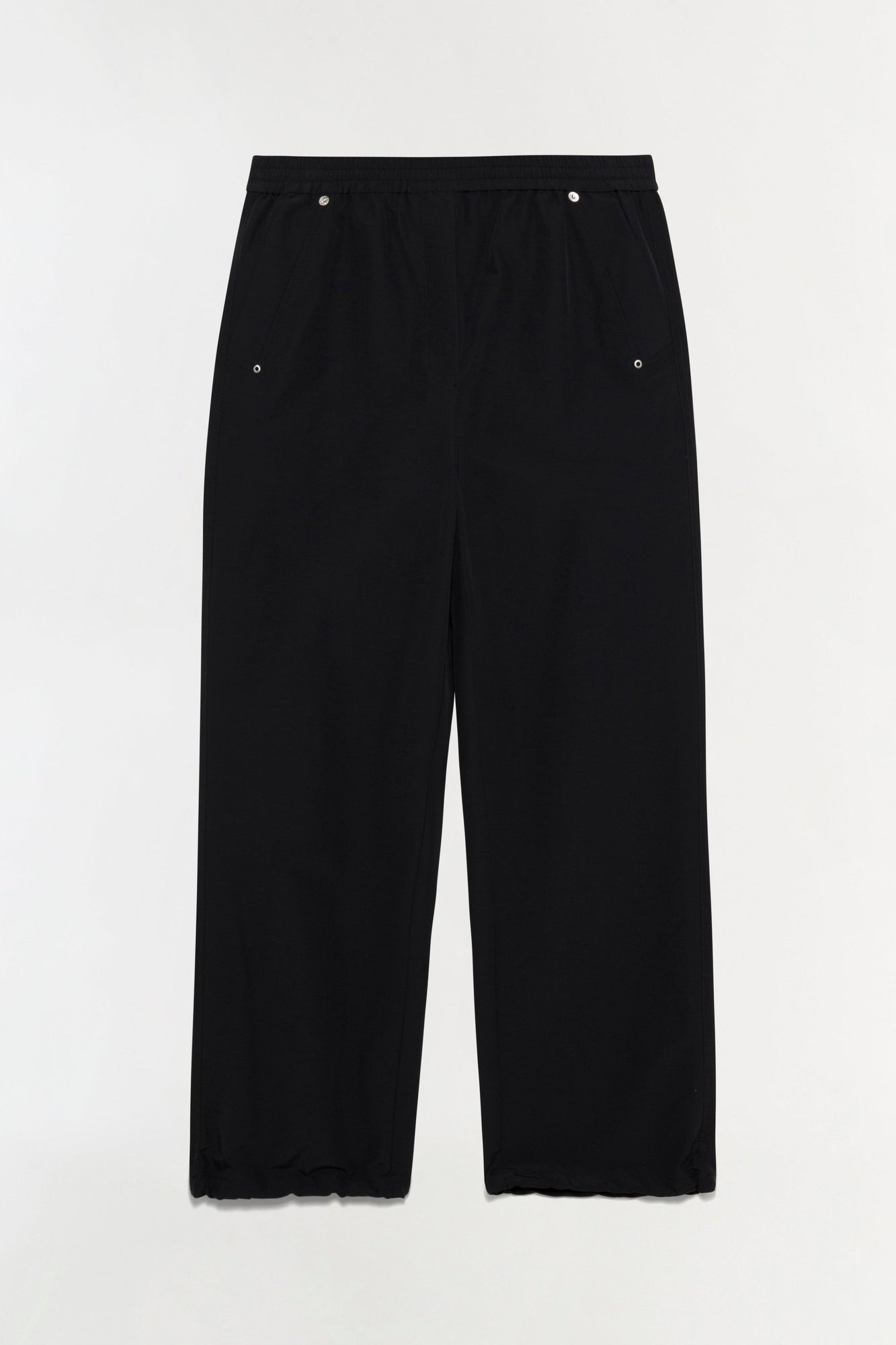 Black cotton pull-on pants with wide legs, elasticized waistband, and decorative metal eyelets at hips and waistband.