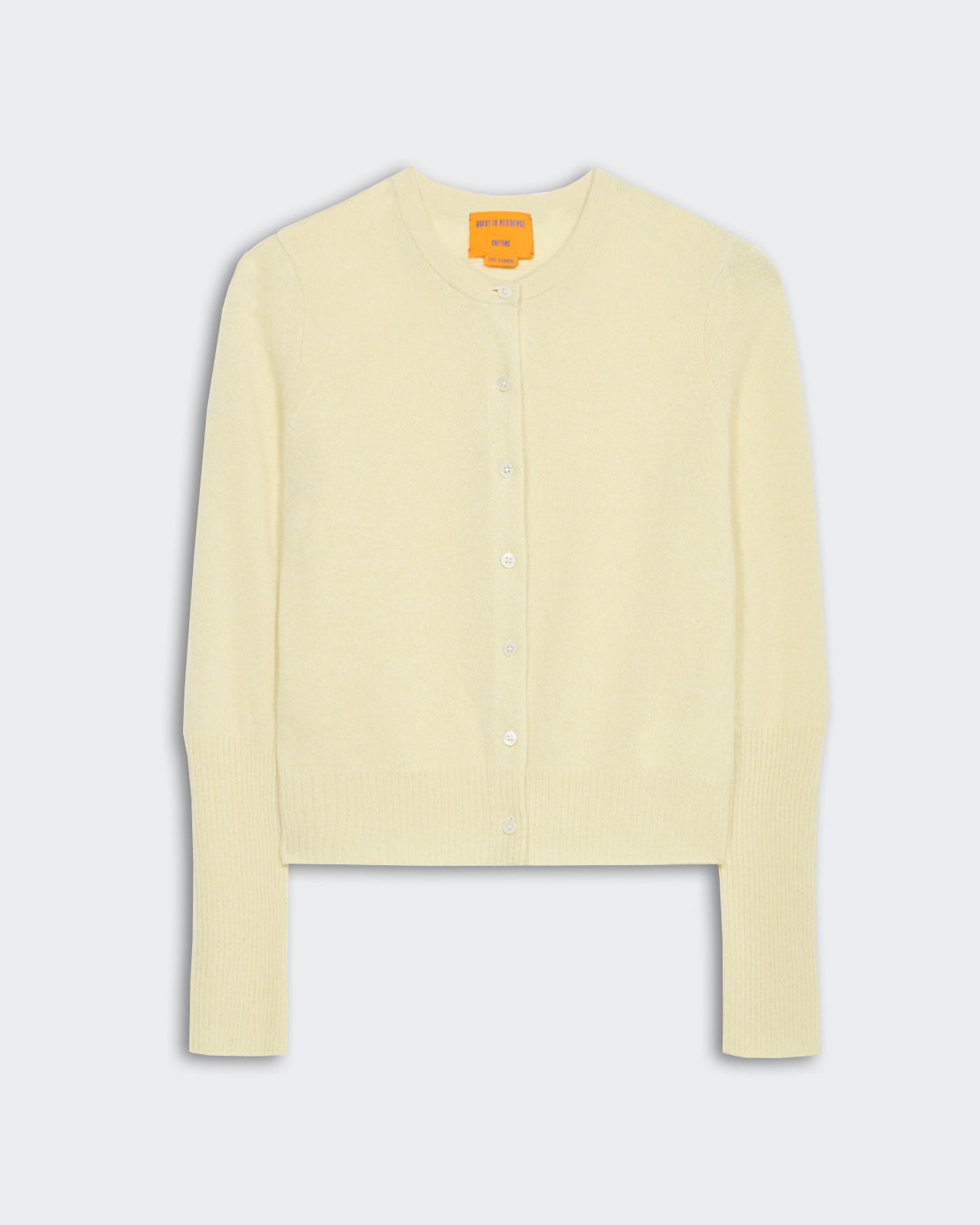 Jane Cardigan - Butter, lightweight cashmere knit with rib hem, cuff trim, and seven-button front closure.