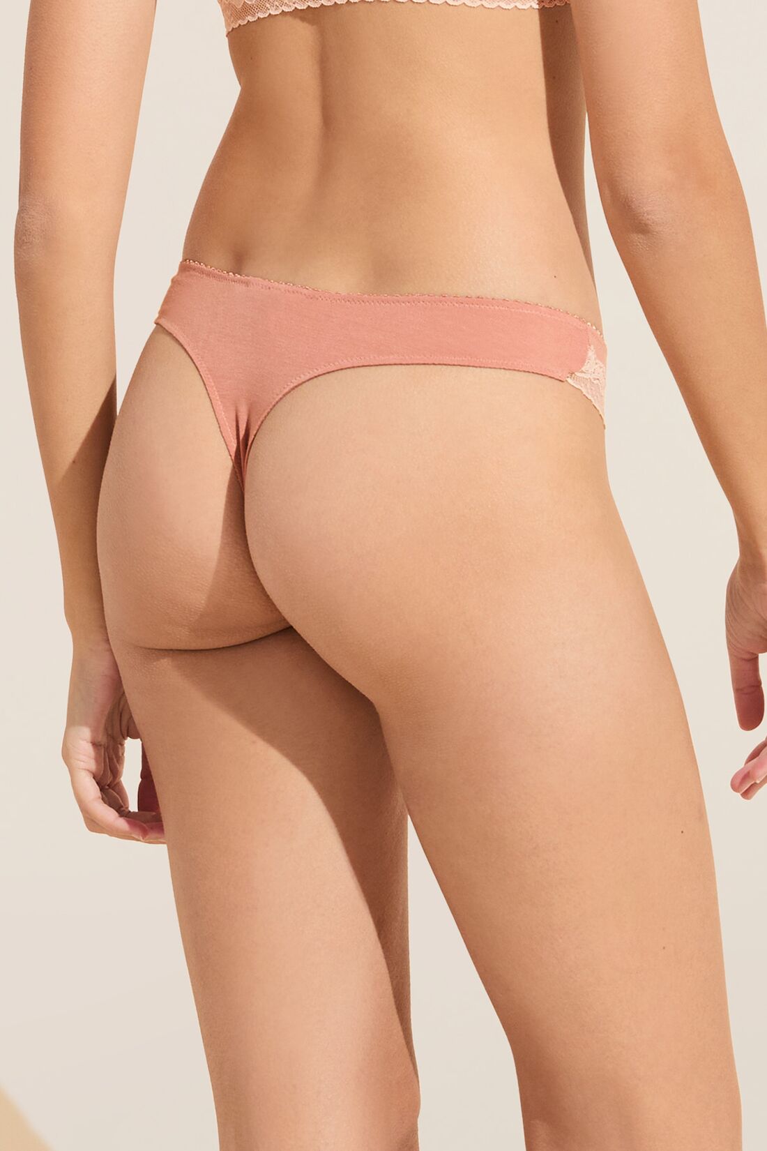Model wears Flora TENCEL Modal Thong in Pink Rouge/Rose.