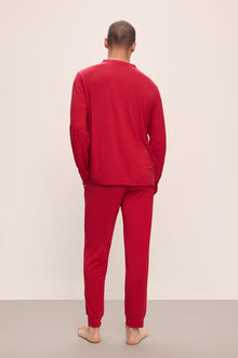 Model wears Henry TENCEL Modal Long PJ Set in Haute Red.