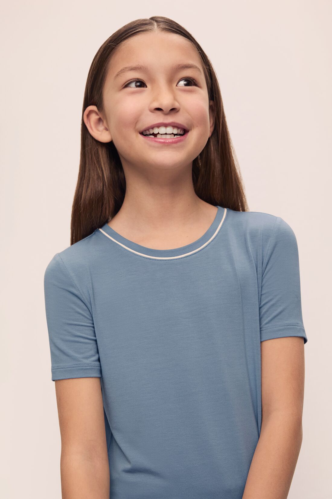 Model is wearing Kids TENCEL Modal Unisex Short PJ Set in Faded Denim/Ivory