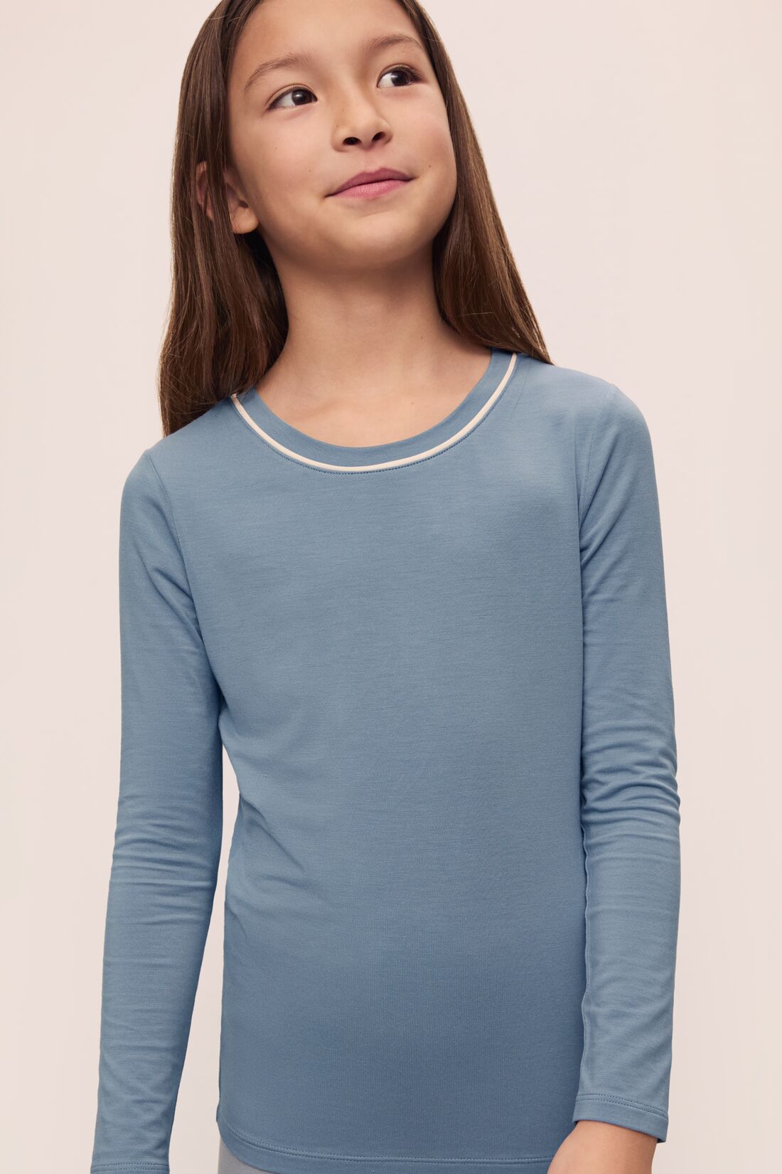 Model is wearing Kids TENCEL Modal Unisex Long PJ Set in Faded Denim/Ivory