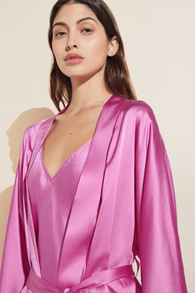 Model wears Inez Washable Silk Short Robe in Italian Rose.