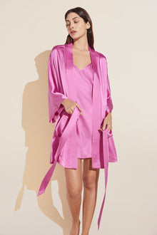 Model wears Inez Washable Silk Short Robe in Italian Rose.