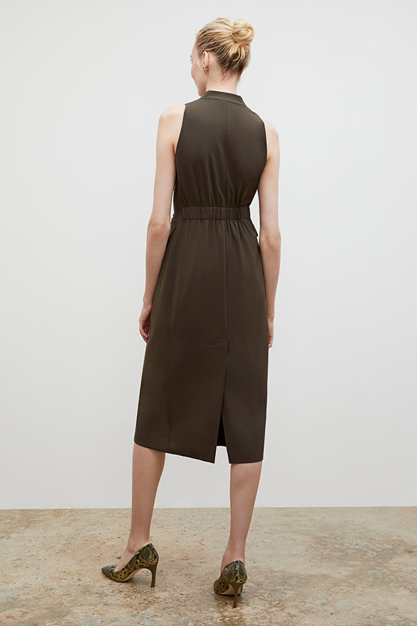 Back image of a woman wearing the Cassandra dress in origamitech in olive | Exclude