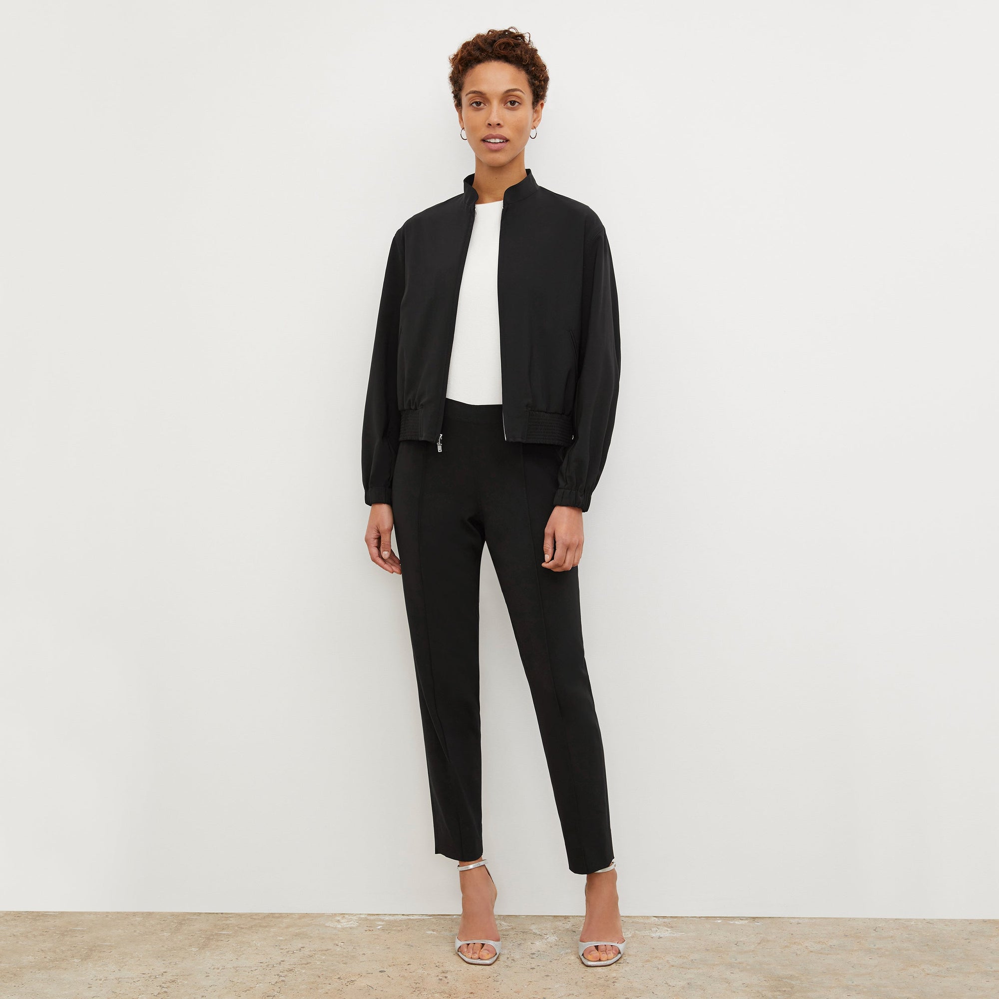 Front image of a woman standing wearing the Colby Jogger in Black