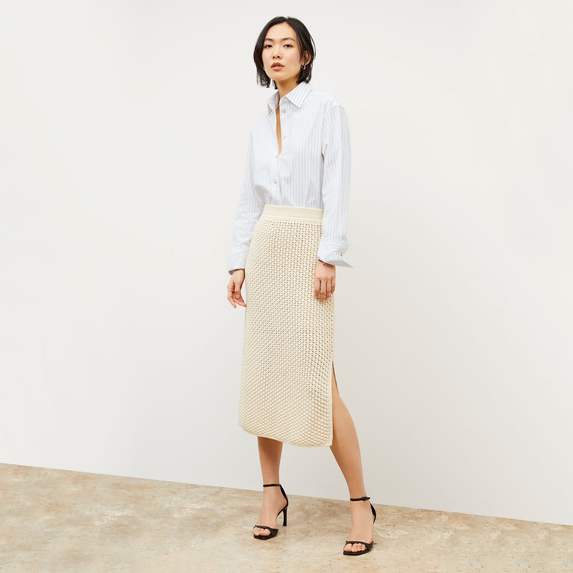 Front image of a woman wearing the Mila Button Down - Poplin Stripe in Blue / Ivory | Exclude
