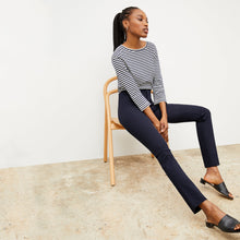Front image of a woman standing wearing the Hockley pant in ink