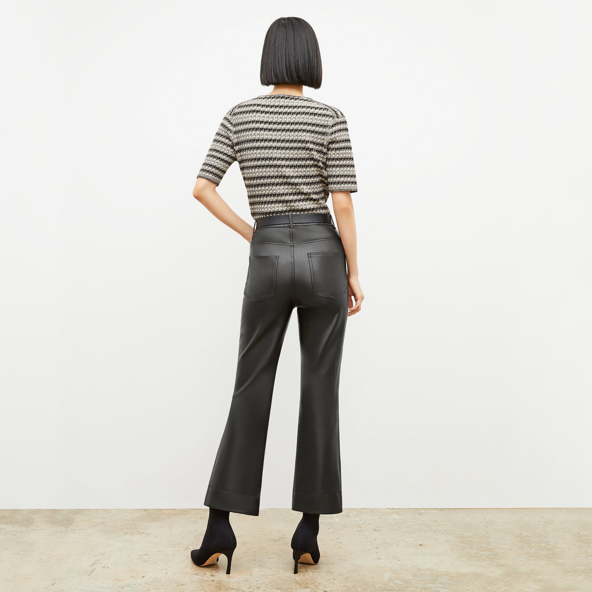 Back image of a woman wearing the archie pant in black | Exclude