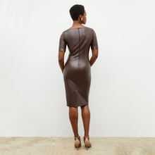 Back image of a woman wearing the noa dress in brown