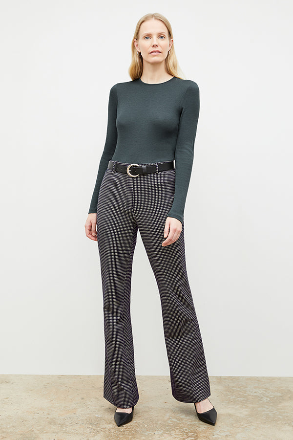 Front image of a woman wearing the horton pant in black and white houndstooth | Exclude | Grid Hover