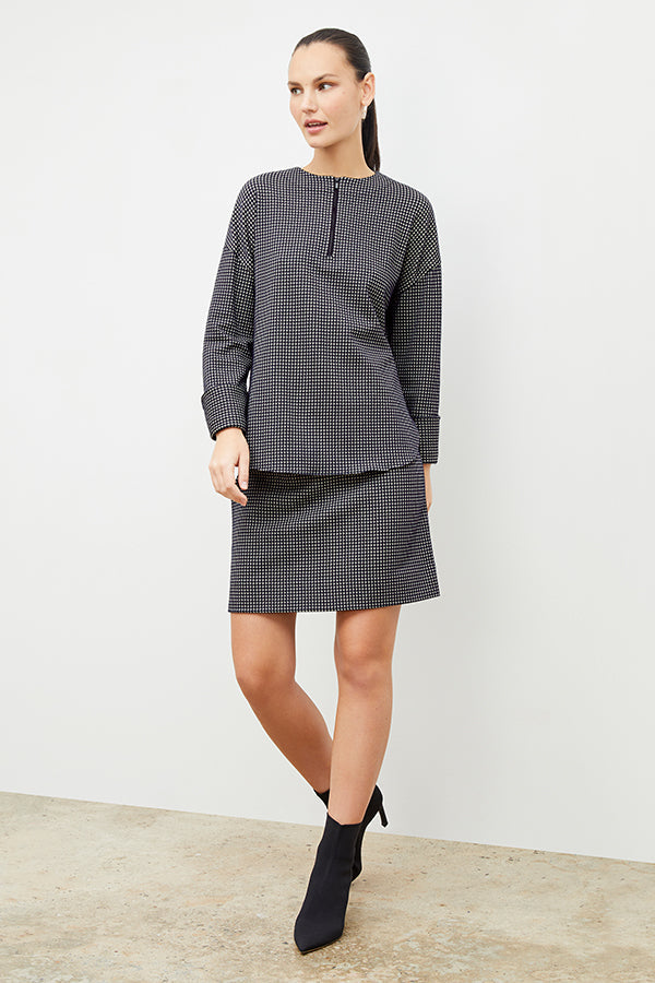 Front image of a woman wearing the whitney skirt in black and white | Exclude