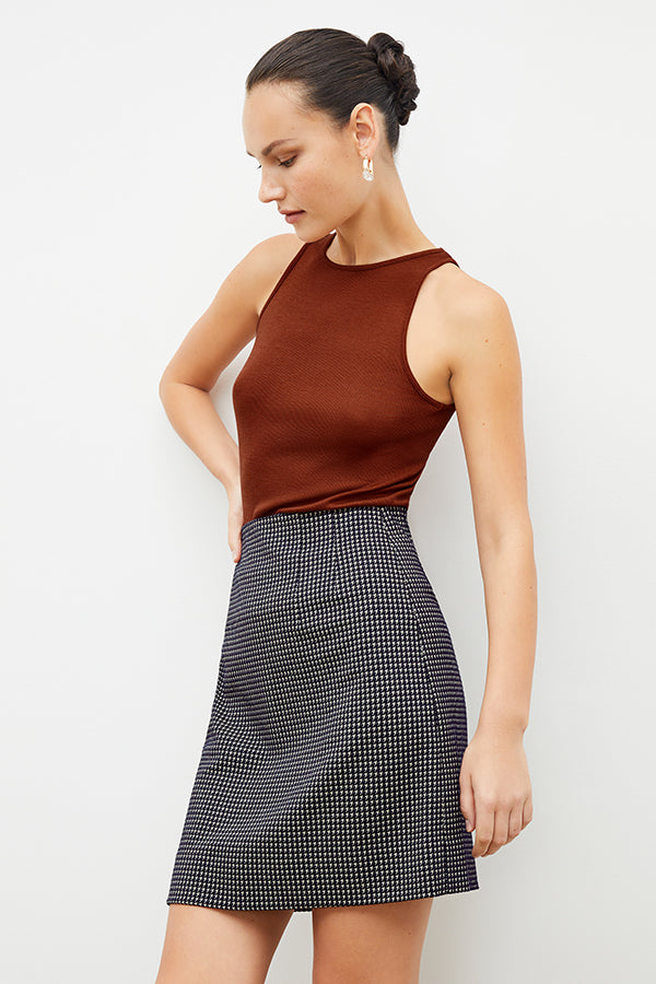 Front image of a woman wearing the whitney skirt in black and white | Exclude