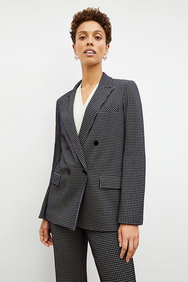 Front image of a woman wearing the horton pant in black and white houndstooth | Exclude