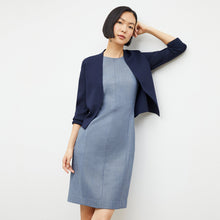 front image of a woman wearing the sant ambroeus jardigan in navy