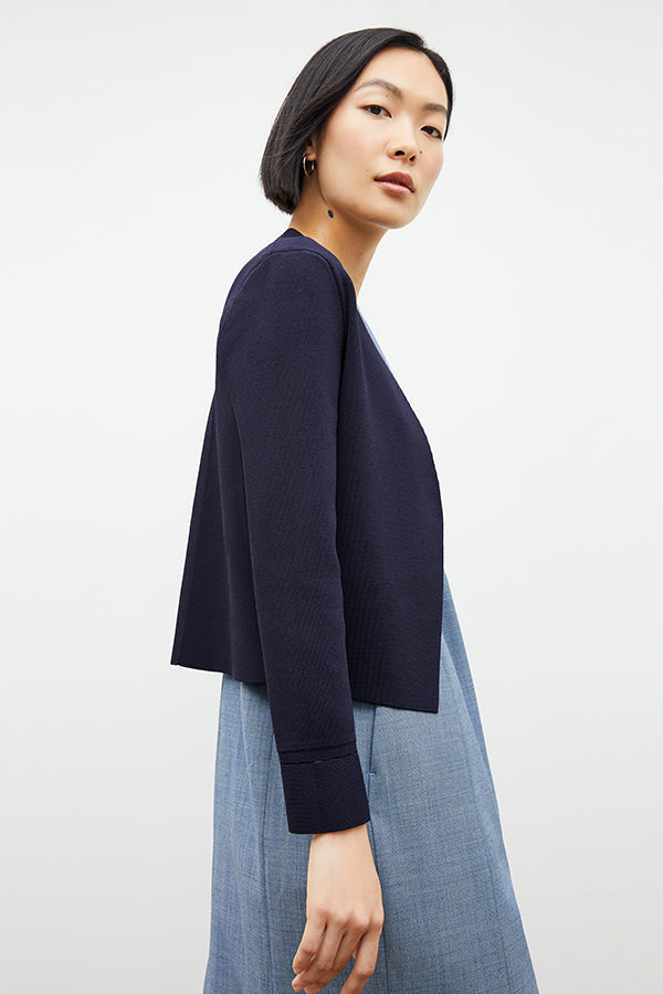 side image of a woman wearing the sant ambroeus jardigan in navy | Exclude