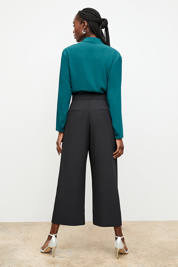Image of a woman wearing the Zhou Culotte - Eco Soft Wave :: Black | Exclude